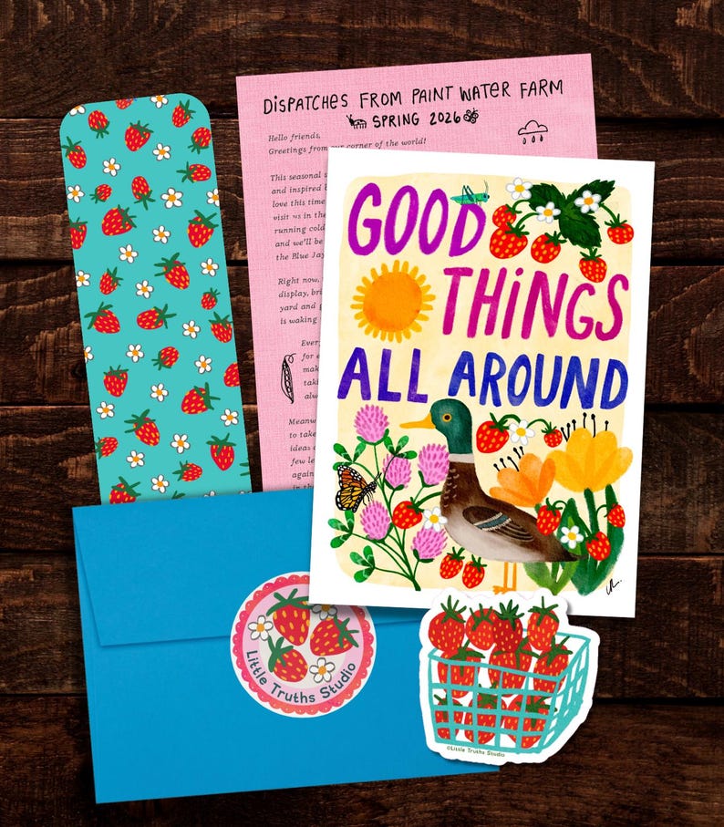 May include: A stationery set featuring a bookmark with a strawberry pattern, a pink newsletter titled Dispatches From Paint Water Farm, a blue envelope with a strawberry sticker, and a card with a mallard duck and the text Good Things All Around.