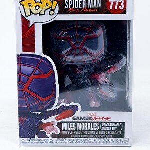 May include: A Marvel Spider-Man Miles Morales Gamerverse collectible figure, number 773, in a box. The figure is in a black and red suit. The box has the Pop! logo and the words "Miles Morales" and "Programmable Matter Suit".