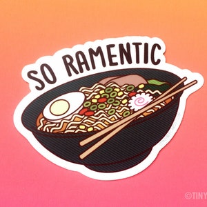 May include: A sticker with a bowl of ramen noodles and chopsticks. The text "SO RAMENTIC" is above the bowl.