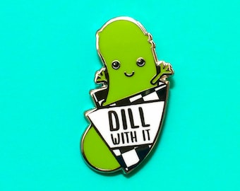 May include: Green pickle cartoon character with a smiling face wearing a black and white checkered hat with the text "Dill with it" on it.