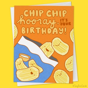 May include: A birthday card with a chip bag design. The card features a cartoon chip bag with smiling chips and a small bowl of dip. The text on the card reads "Chip Chip hooray, it's your birthday!"