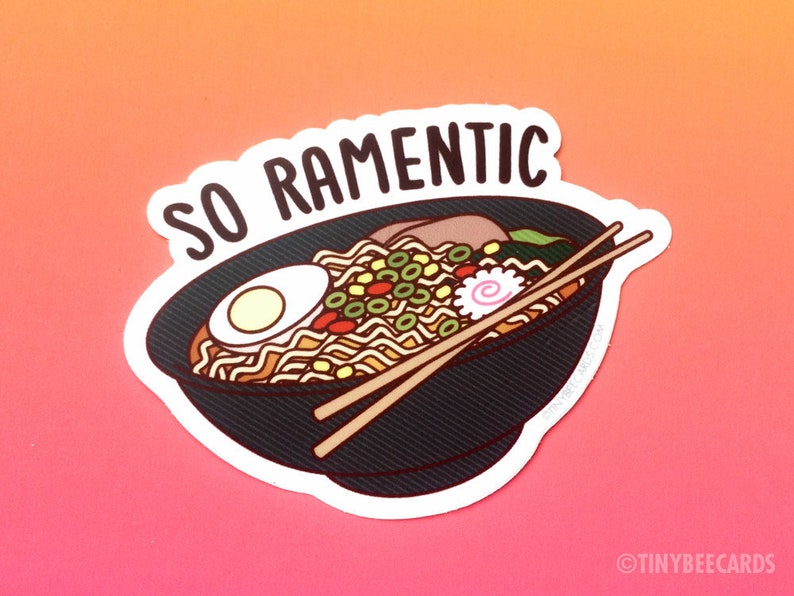 May include: A sticker with a bowl of ramen noodles and chopsticks. The text "SO RAMENTIC" is above the bowl.