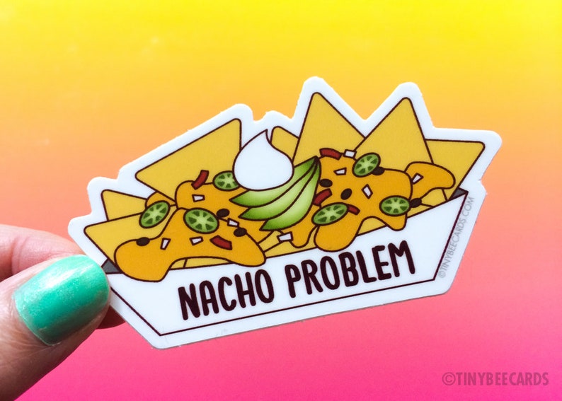 May include: A white sticker with a cartoon illustration of a bowl of nachos with sour cream, guacamole, and jalapenos. The text "NACHO PROBLEM" is written in black letters on the sticker.