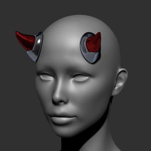 May include: A digital 3D rendering of a smooth gray mannequin head featuring two pointed red devil horns. Each horn is attached to the head with a polished silver metallic base plate, creating a distinct contrast between the red, silver, and gray.