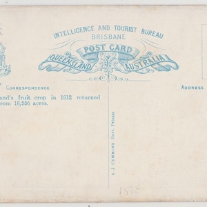 May include: Vintage postcard from the Intelligence and Tourist Bureau in Brisbane, Australia. The postcard features text and illustrations in blue, including the Queensland coat of arms, a map, and the text "Queensland Australia". The text states Queensland's fruit crop in 1912.