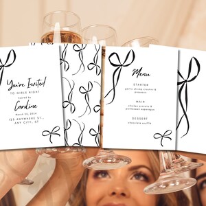 May include: Four white cards with black ink illustrations of bows. The cards are held by two people. One card says "You're Invited to Girls Night hosted by Cardine March 20, 2024 123 Anywhere St. Any City, ST". Another card says "Menu Starter Garlic Shrimp Crostini & Prosecco Main Chicken Piccata & Parmesan Asparagus Dessert Chocolate Souffle".