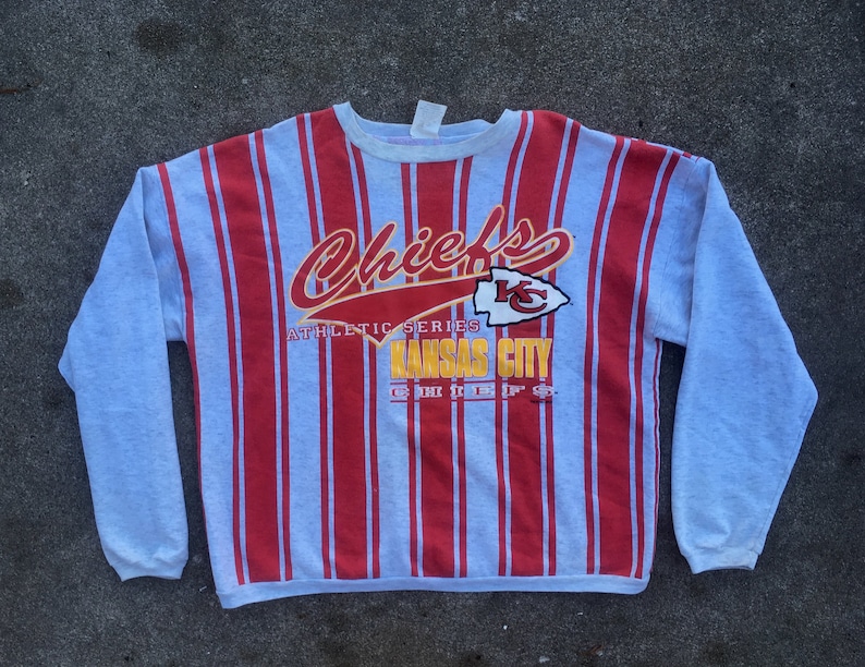 Vintage 1990s Cliff Engle NFL Kansas City CHIEFS All Over Print Striped Crew Neck SWEATSHIRT Size Extra Large Football Starter Swag Hipster Vintage 1990s Cliff Engle NFL Kansas City CHIEFS All Over Print Striped Crew Neck SWEATSHIRT Size Extra Large Football Starter Swag Hipster