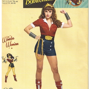 May include: Simplicity pattern for a Wonder Woman costume. The pattern features a red top with white trim, blue shorts with white stars, a gold belt, and red boots. The image includes the text "DC Comics Bombshells" and "Wonder Woman".