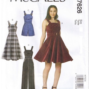 May include: McCall's sewing pattern M7626 featuring four different garment designs: a dress, a romper, a jumpsuit, and a plaid dress. The main image shows a woman wearing a burgundy dress with a belt. The pattern includes size and talla information.