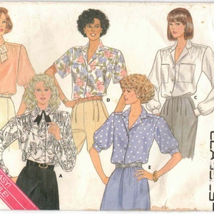 May include: A vintage sewing pattern for four different blouses. The pattern is for sizes 10-12 and is from the Butterick Classics line. The pattern features a floral print blouse, a polka dot blouse, a white blouse with a bow, and a white blouse with a ruffled collar.