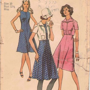 May include: Vintage sewing pattern for a dress with a polka dot print. The pattern is for size 10, bust 32 1/2 inches, and is for a miss. The pattern is from Simplicity and is number 9396.