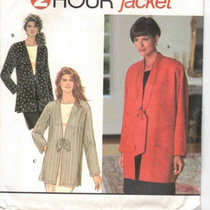 May include: Simplicity sewing pattern number 9356 for a 2-hour jacket. The pattern includes three different styles: a red jacket with a tie, a black and white patterned jacket, and a striped jacket with a tie. The pattern is for sizes XS, S, and M.