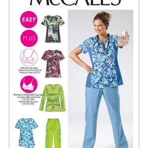 May include: A sewing pattern for scrubs featuring a blue floral print top and matching trousers. The pattern includes sizes for A/B, C/D, and C/D, DD, DDD cup sizes. The pattern is labelled "Easy" and "Plus".