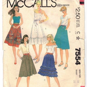 May include: A vintage sewing pattern for four different skirts. The pattern is for size 10 and has a waist measurement of 25 inches. The skirts are shown on four different models. The skirts are all different styles and colors. The pattern is from McCall's and is number 7554.
