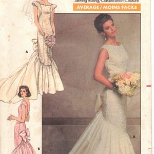 May include: A vintage Butterick sewing pattern, number 5941, featuring illustrations of wedding dresses. The cover displays a detailed drawing of a bridal gown with a mermaid silhouette and a pink dress with a large bow.