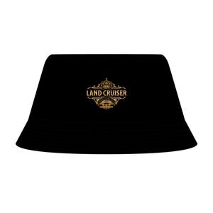 May include: A solid black bucket hat featuring a centered gold-colored graphic emblem. The design includes a crown icon above the text LAND CRUISER, with the words COLLECTORS CLUB printed in a circular banner surrounding a small vehicle illustration.