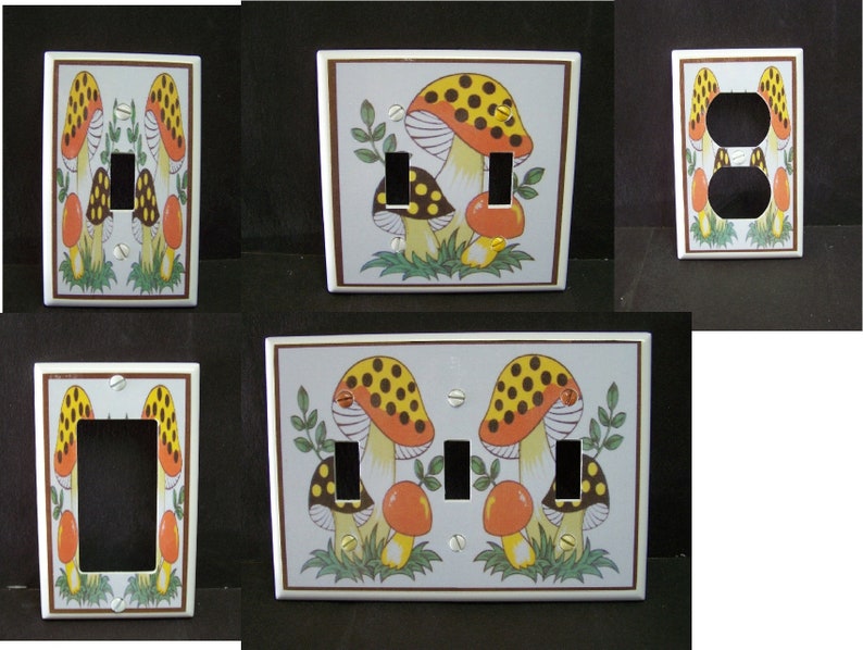 May include: Set of four light switch and outlet covers featuring a mushroom design. The covers are white with a brown border and feature a colorful mushroom illustration with red, yellow, and black accents.