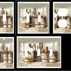 May include: A set of five light switch and outlet covers featuring a watercolor painting of a rustic kitchen scene with wooden shelves, jars, and utensils. The covers are white with a light brown border.