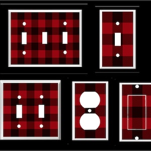 May include: Set of five light switch and outlet covers featuring a red and black buffalo plaid pattern. The covers are white with a thin black border.