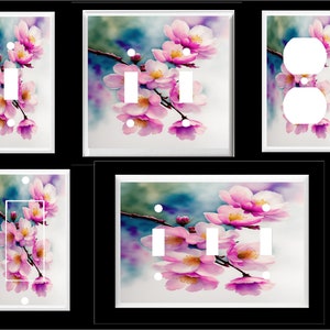 May include: Set of five light switch and outlet covers featuring a watercolor painting of pink cherry blossoms on a blue and purple background.