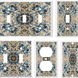 May include: Set of six decorative light switch and outlet covers featuring a blue and gold floral pattern. The pattern is reminiscent of traditional Italian tilework.