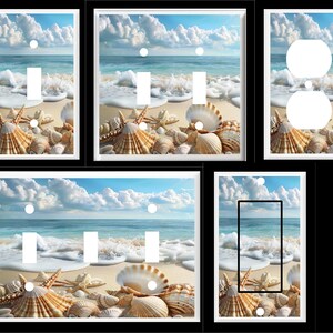 May include: A set of decorative light switch and outlet covers featuring a beach scene with seashells and ocean waves. The covers are white with a glossy finish.