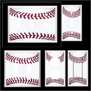 May include: Set of four white light switch and outlet covers with a baseball stitching design. The stitching is red and white.