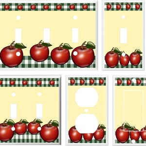 May include: Set of six light switch and outlet covers featuring a red apple design on a green and white checkered background. The covers are made of durable plastic and are easy to install.