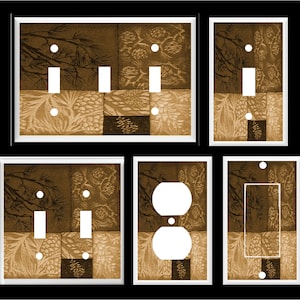 May include: Set of six decorative light switch and outlet covers featuring a brown and beige patchwork design with pine cones and branches.