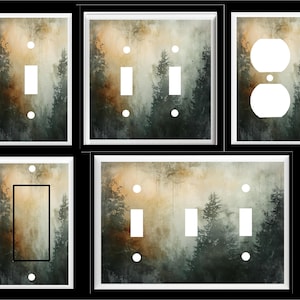 May include: Set of five light switch and outlet covers featuring a misty forest scene with tall trees and a soft, muted color palette. The covers are white with a decorative overlay.