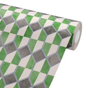 May include: A roll of wallpaper featuring a repeating geometric pattern of three-dimensional cubes. The cubes are colored in shades of green, gray, and off-white, outlined with a thin blue line. The wallpaper is designed for home decor.