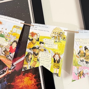 May include: A decorative bunting banner made from three rectangular pages of a children's book featuring colorful illustrations of characters dressed as bees, with printed dialogue bubbles and text, all strung together on a thin brown twine cord.