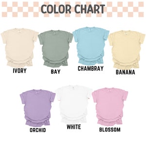 a bunch of different colored shirts on a white background