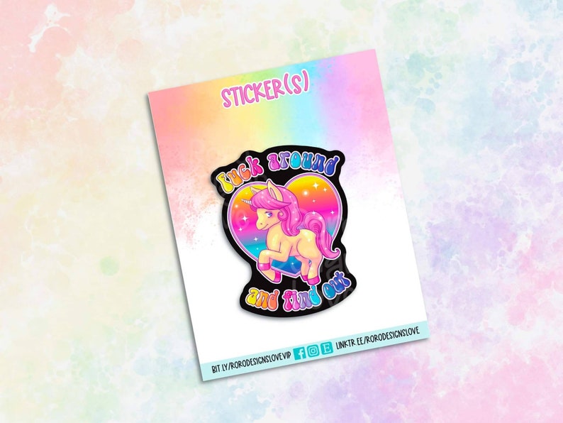 May include: A sticker featuring a cartoon unicorn with a rainbow heart and the text "Look around and find out".