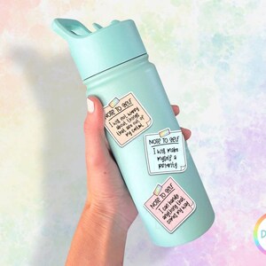 May include: A turquoise water bottle with three colorful sticky notes attached. The notes have the text "Note to self" and positive affirmations.
