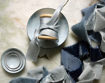 Styling dish set, a set of four miniature enamelled styling dishes in a pale dusky blue grey shade with hand-dyed blue grey silk ribbon