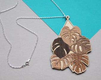 Laser cut wood & silver Monstera Deliciosa necklace.