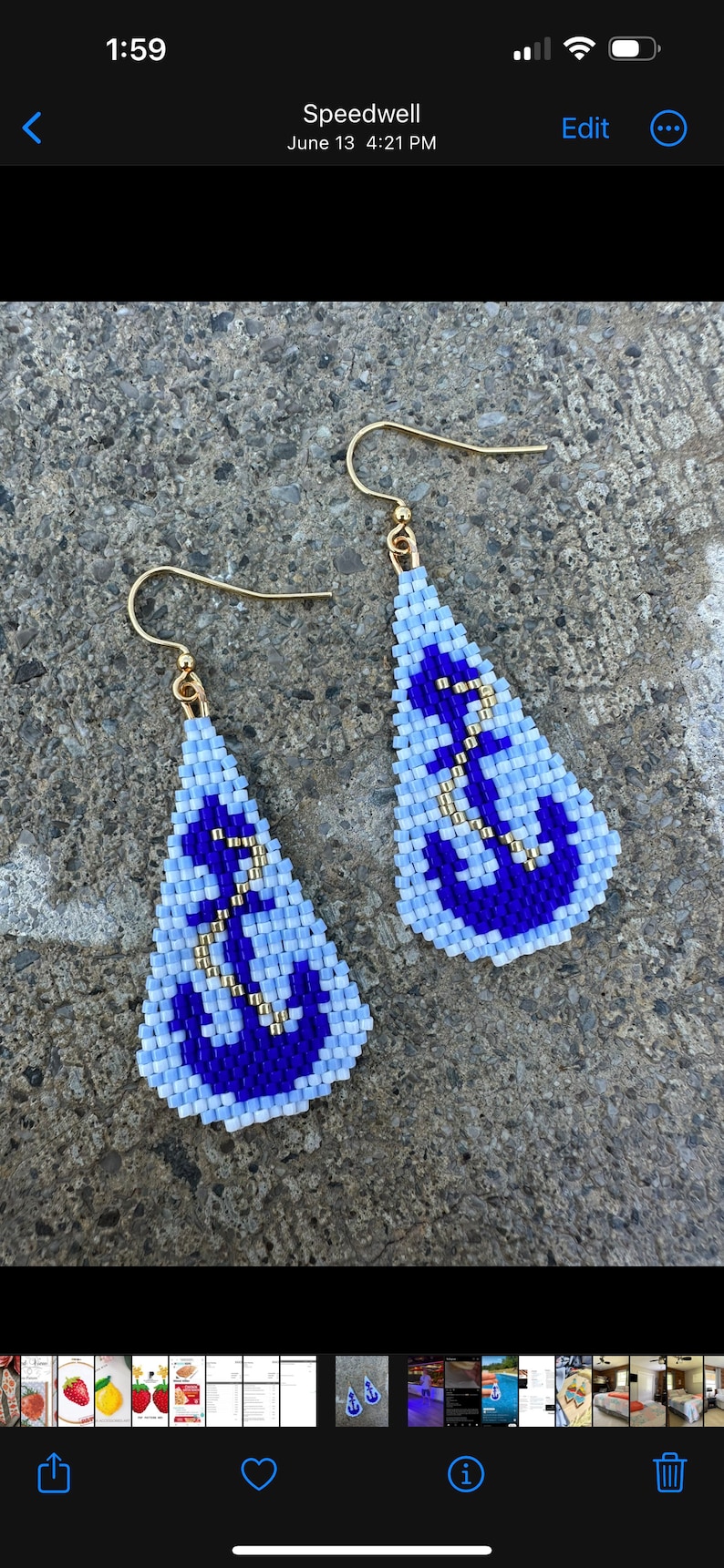 May include: Teardrop-shaped beaded earrings with a nautical anchor design. The earrings are light blue and dark blue, with gold-coloured accents. The earrings have gold-coloured ear wires.