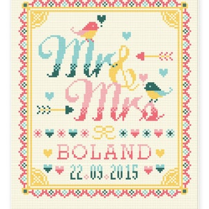May include: Cross-stitch design featuring "Mr & Mrs" in teal, pink, and yellow, with birds and arrows. The design includes the name "BOLAND" and the date "22.09.2015" in a decorative frame. The background is a light beige color.
