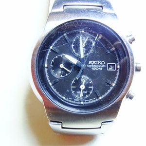 Zegarek Seiko Chrono vintage kwarcowy z alarmem i chronografem, 100 m, 7T62A, OBHO, oryginalna książka, data, centralna sekunda, stalowe ogniwa