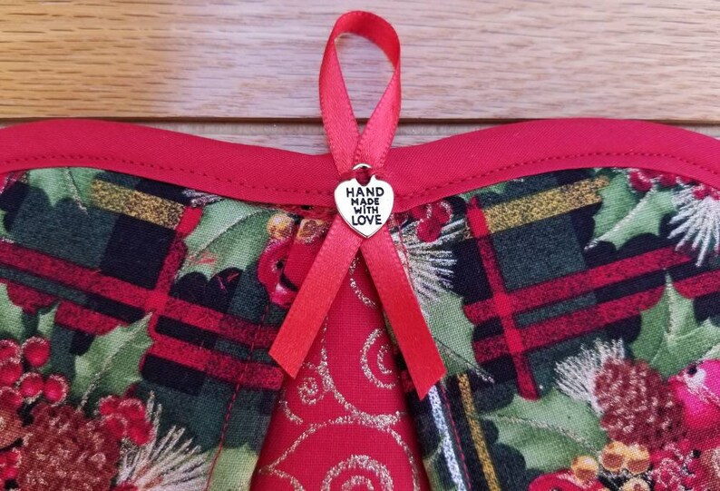 Set of two Handmade handy heart Christmas holly and bells potholders pinecones