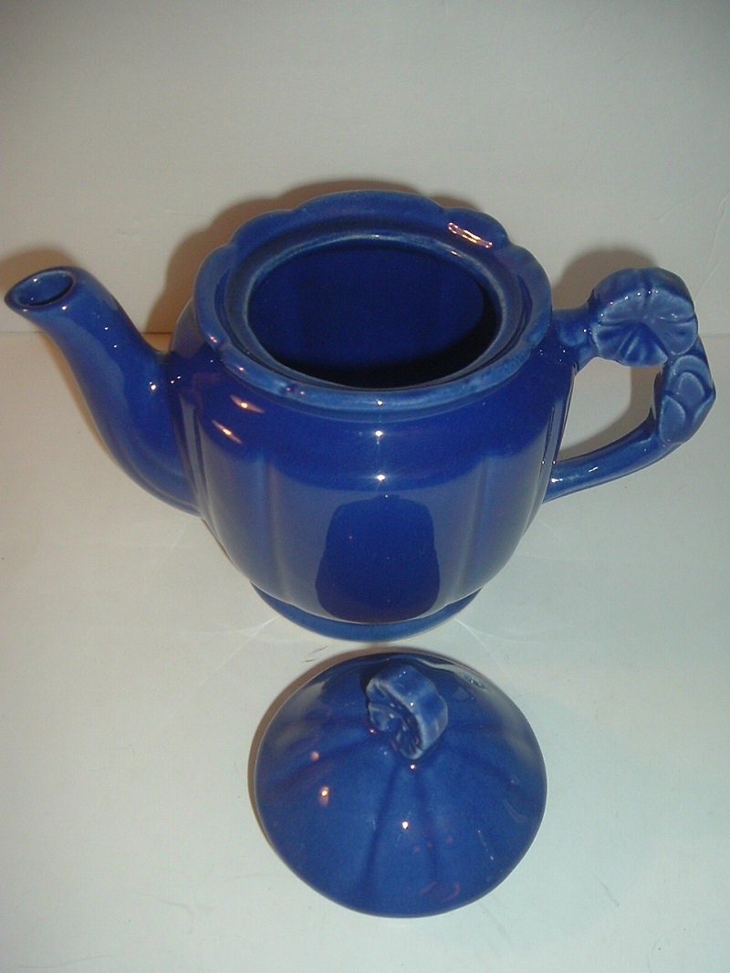 Vintage USA Blue Pottery Teapot with Flower Handle and Finial