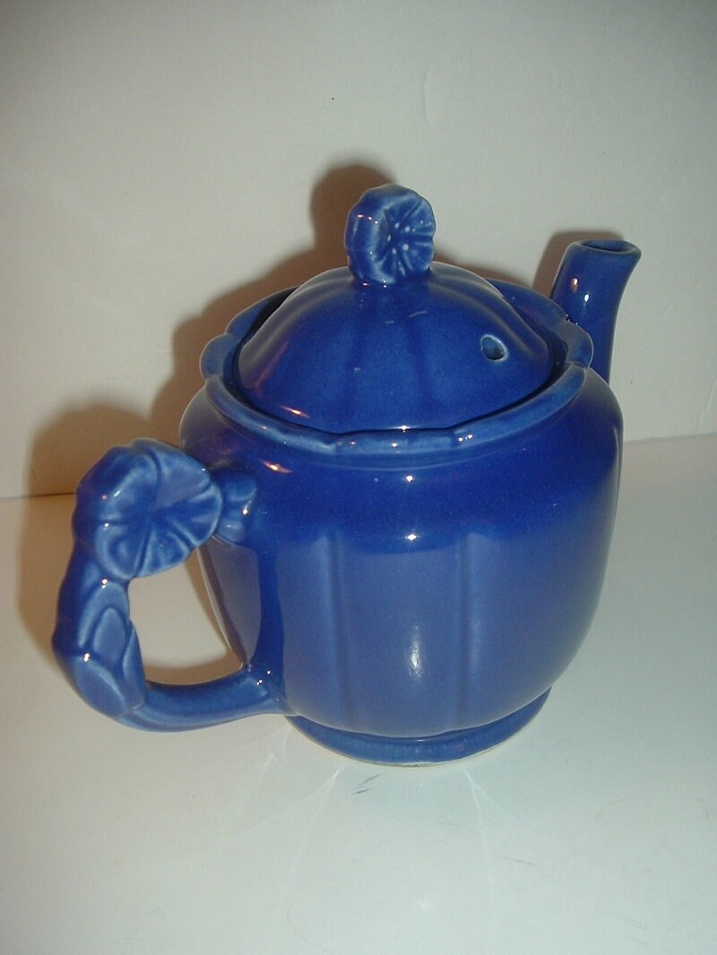 Vintage USA Blue Pottery Teapot with Flower Handle and Finial