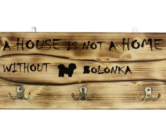 Bolonka, a wooden wall peg, hanger with the picture of a dog and the words: "A house is not a home without..."