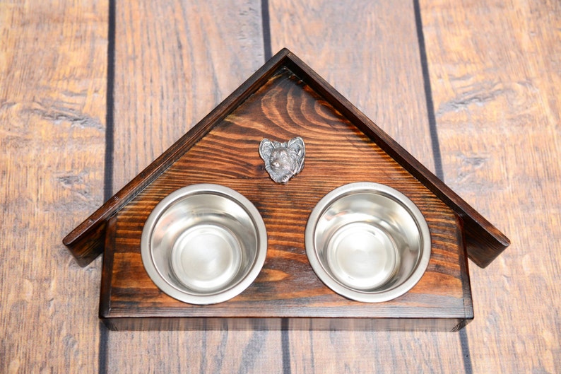 A dog\u2019s bowls with a relief from ARTDOG collection Papillon