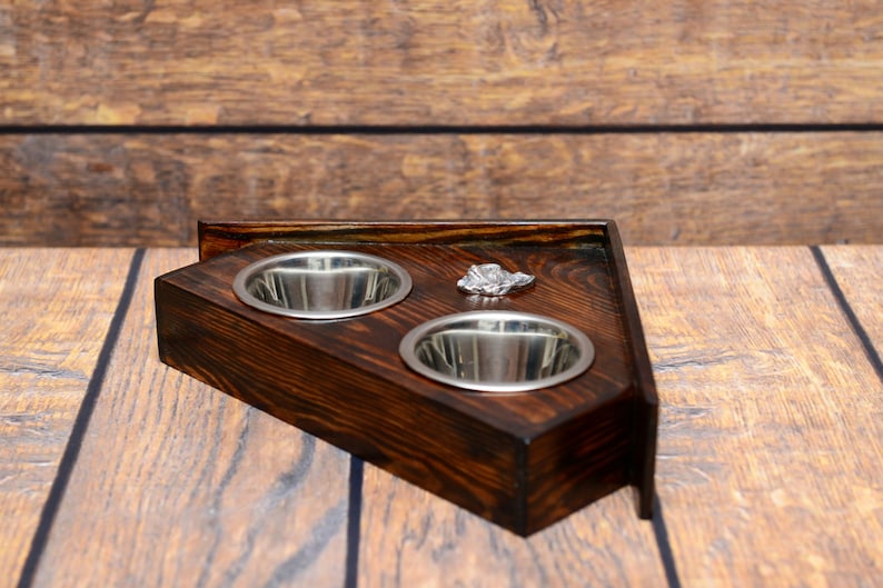 A dog\u2019s bowls with a relief from ARTDOG collection Papillon