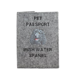 May include: Gray felt pet passport holder with the text "PET PASSPORT" and an embroidered image of an Irish Water Spaniel with the text "IRISH WATER SPANIEL" underneath.