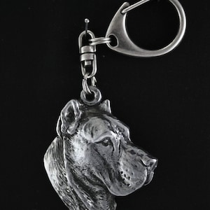 May include: Silver-toned keychain featuring a detailed, three-dimensional head of a Cane Corso dog breed.