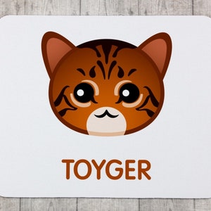 A computer mouse pad with a Toyger cat. A new collection with the cute Art-dog cat