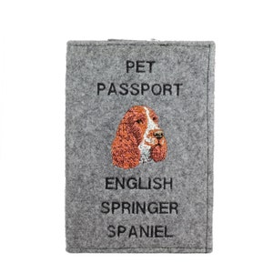 May include: Gray felt pet passport with the text "PET PASSPORT" and an embroidered image of an English Springer Spaniel.